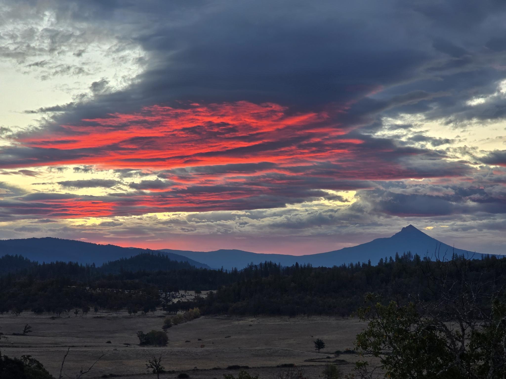 Beautiful sunset over Indian Lake with mountains in the background